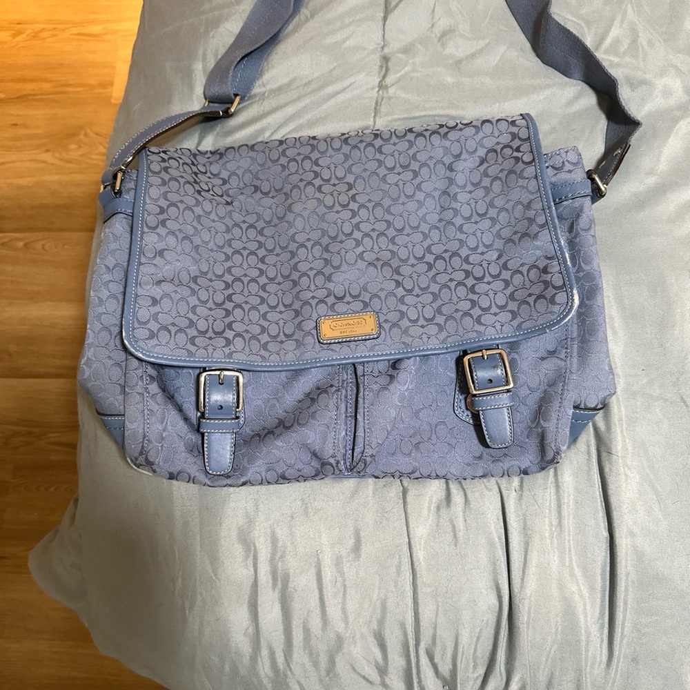 Blue Coach bag can be used for a laptop or weekend getaway bag.